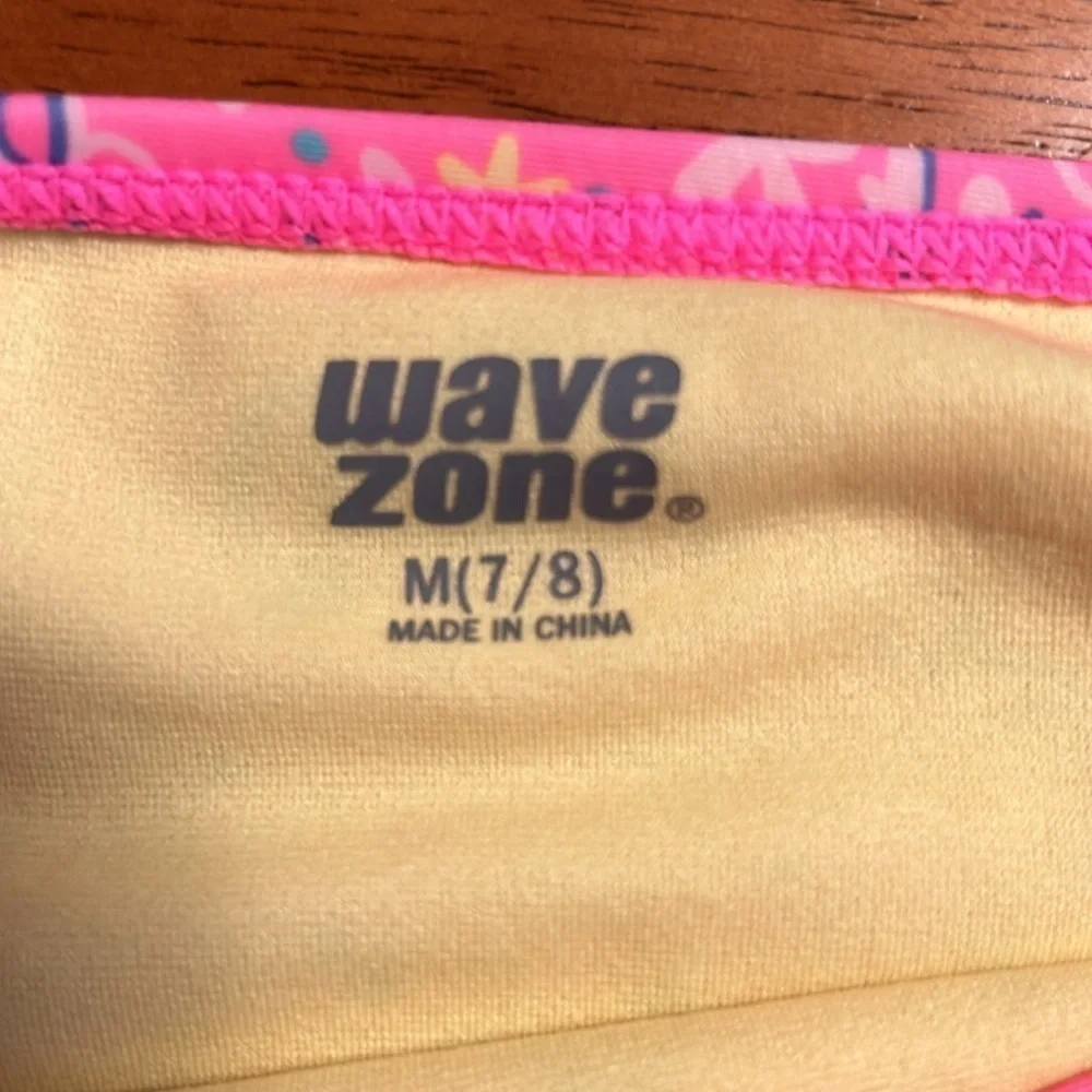Girls set of swimsuits, pink set is a 7/8 and the one piece is a small.